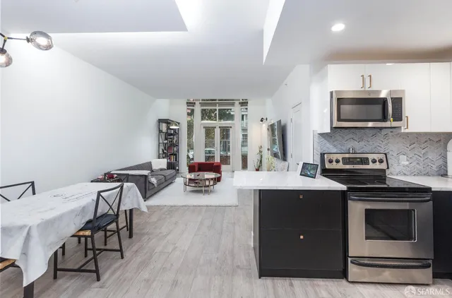 a view of kitchen with sink and microwave