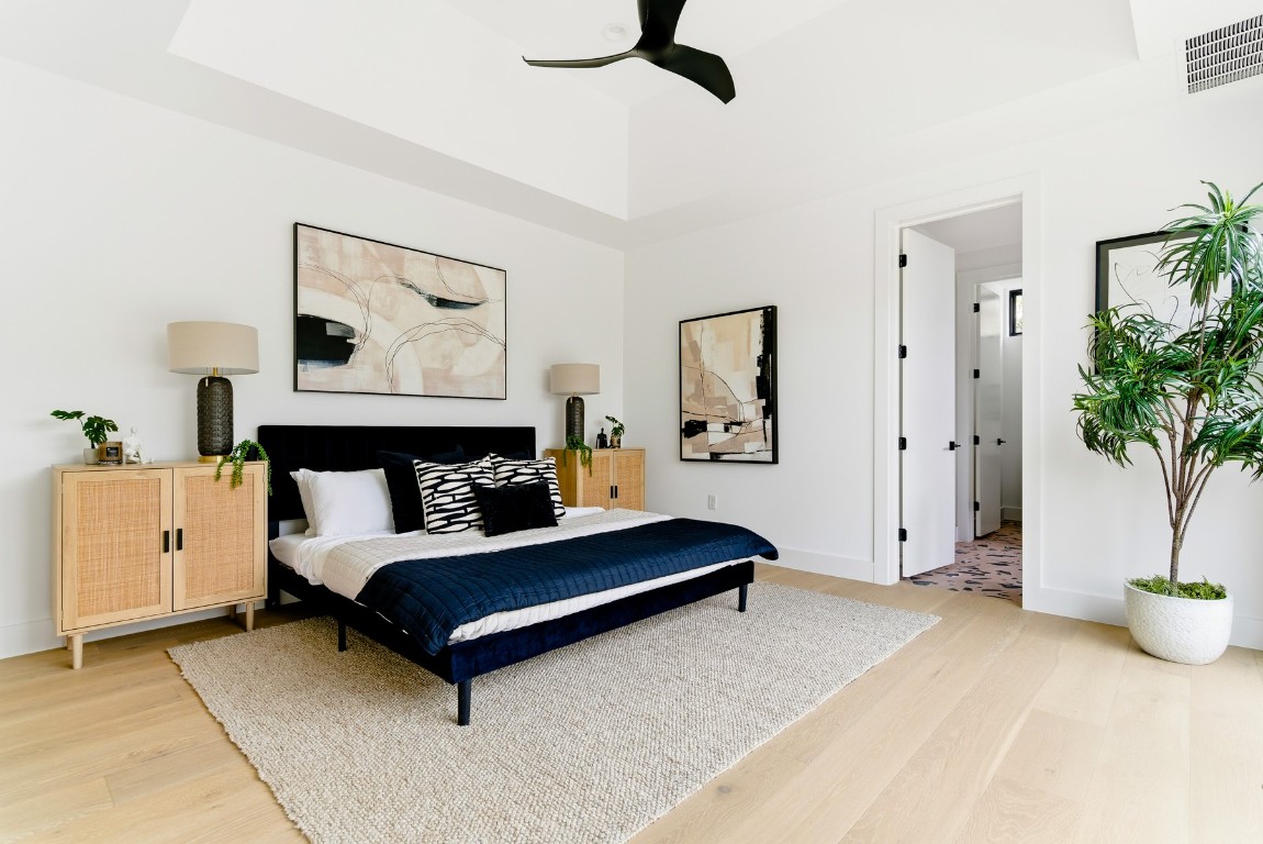 4613 Bolm Road Austin, TX 78702 - Photo 19 of 40 Bedroom with light wood finished floors and ceiling fan