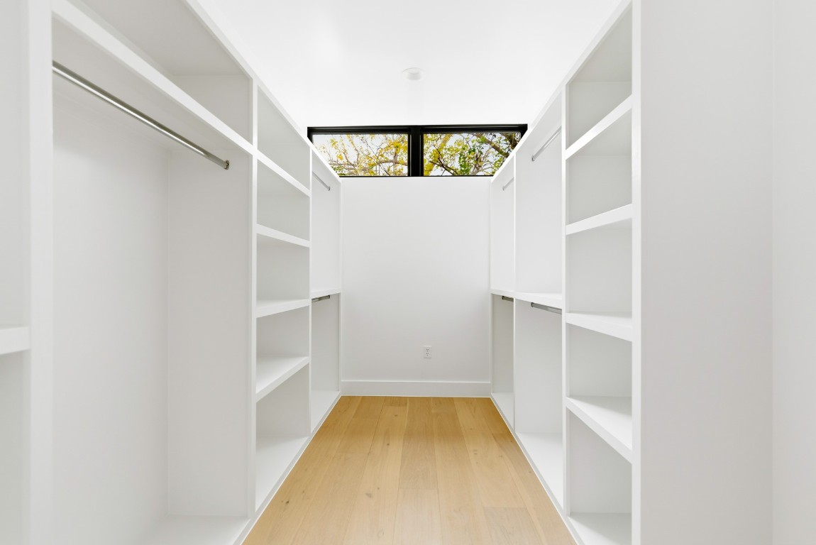 4613 Bolm Road Austin, TX 78702 - Photo 24 of 40 Walk in closet featuring light wood-type flooring