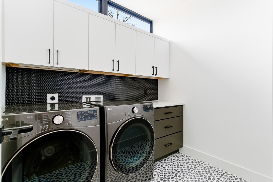 4613 Bolm Road Austin, TX 78702 - Photo 25 of 40 Washroom featuring cabinet space and washing machine and clothes dryer