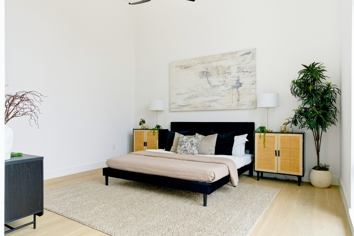 4613 Bolm Road Austin, TX 78702 - Photo 30 of 40 Bedroom with light wood finished floors and baseboards