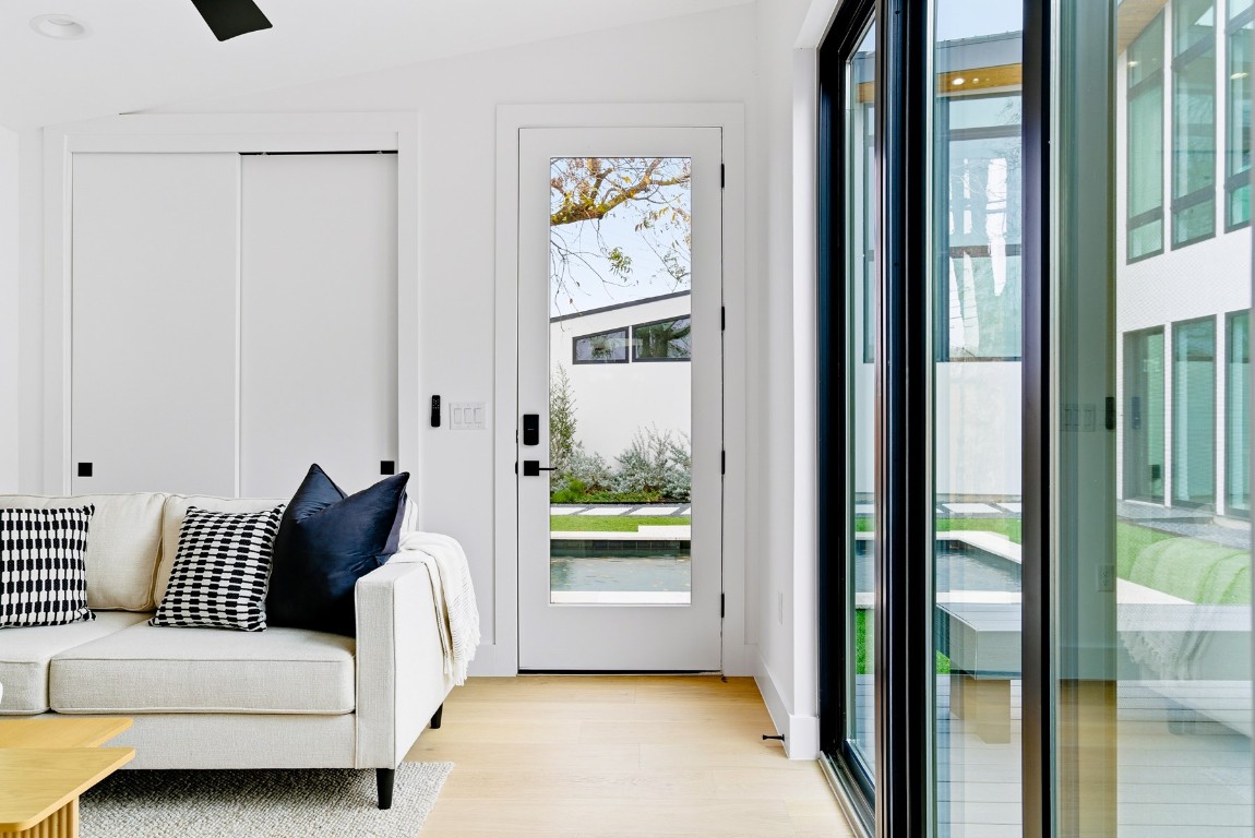 4613 Bolm Road Austin, TX 78702 - Photo 35 of 40 Doorway with wood finished floors and vaulted ceiling