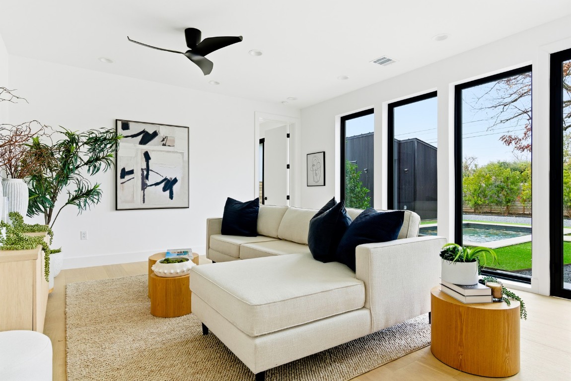 4613 Bolm Road Austin, TX 78702 - Photo 8 of 40 Living area featuring light wood-type flooring, ceiling fan, and recessed lighting