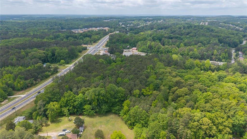 0 Macland Road Dallas, GA 30157 - Photo 6 of 12 a view of a forest with a houses