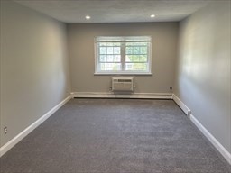 445 Pleasant Street, Unit 32 Weymouth, MA 02190 - Photo 2 of 7 an empty room with a window