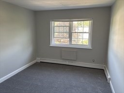 445 Pleasant Street, Unit 32 Weymouth, MA 02190 - Photo 7 of 7 an empty room with a window