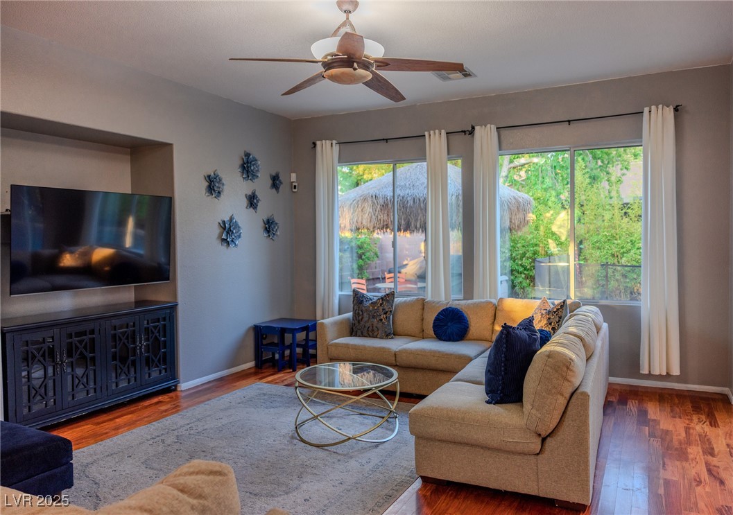 212 Malcolm Street Henderson, NV 89074 - Photo 11 of 47 Living room with wood finished floors and ceiling fan