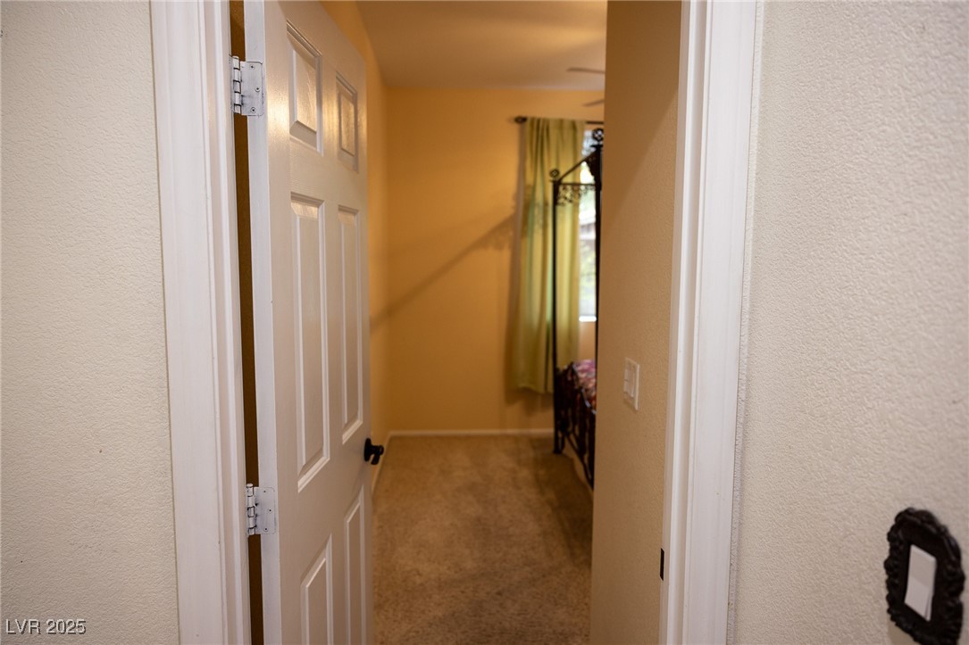 212 Malcolm Street Henderson, NV 89074 - Photo 16 of 47 Corridor featuring carpet flooring and a textured wall