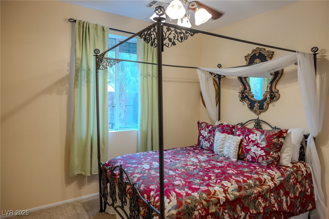 212 Malcolm Street Henderson, NV 89074 - Photo 17 of 47 Downstairs Bedroom with carpet floors and baseboards