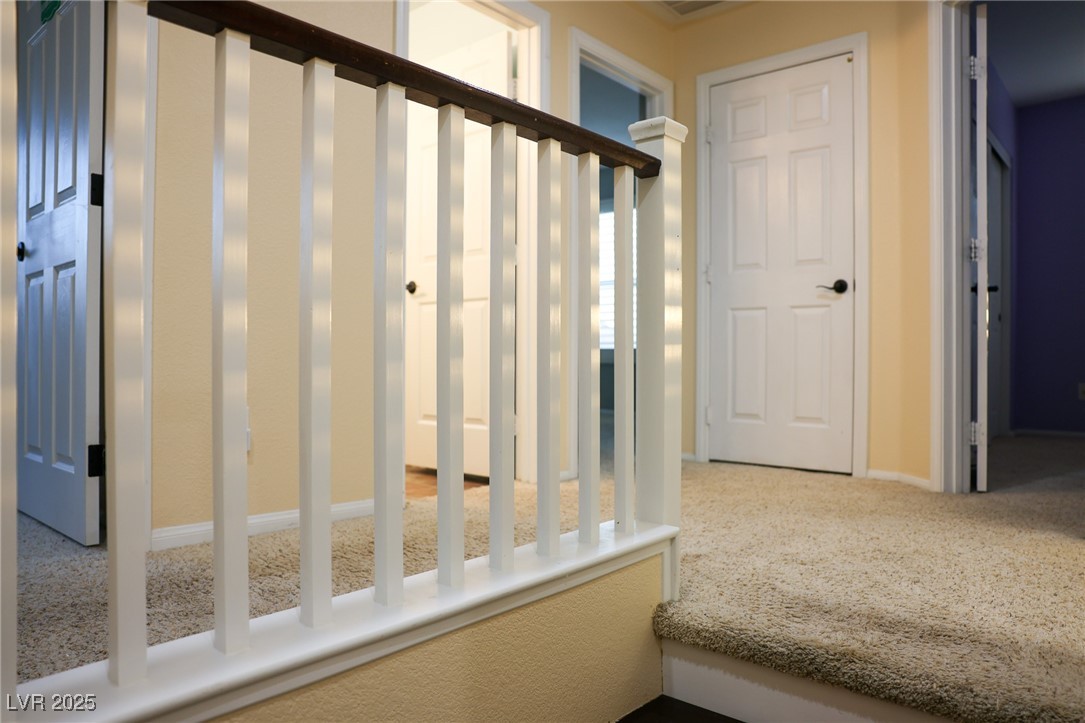 212 Malcolm Street Henderson, NV 89074 - Photo 21 of 47 Stairs featuring healthy amount of natural light and carpet floors
