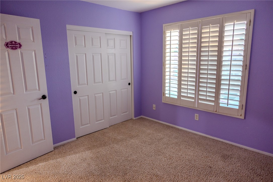 212 Malcolm Street Henderson, NV 89074 - Photo 23 of 47 UPSTAIRS Unfurnished bedroom featuring carpet . UPSTAIRS. flooring and a closet