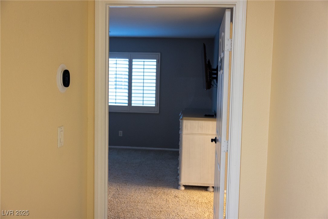 212 Malcolm Street Henderson, NV 89074 - Photo 29 of 47 Hallway with light carpet