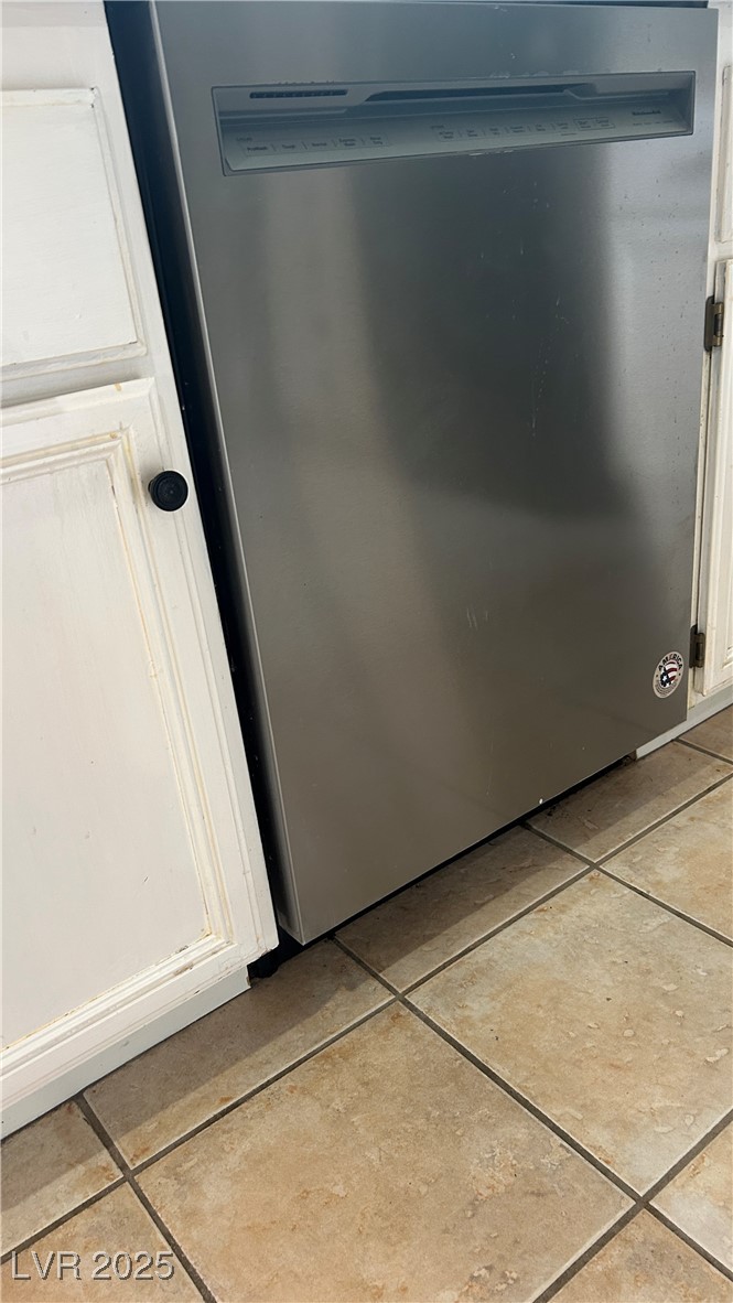 212 Malcolm Street Henderson, NV 89074 - Photo 38 of 47 Kitchen view of Stainless steel dishwasher and white cabinetry
