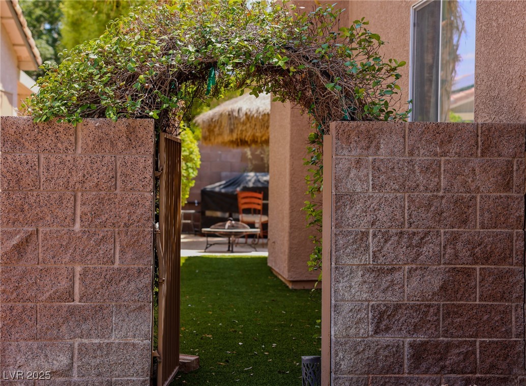 212 Malcolm Street Henderson, NV 89074 - Photo 4 of 47 View of yard with a patio and an outdoor fire pit