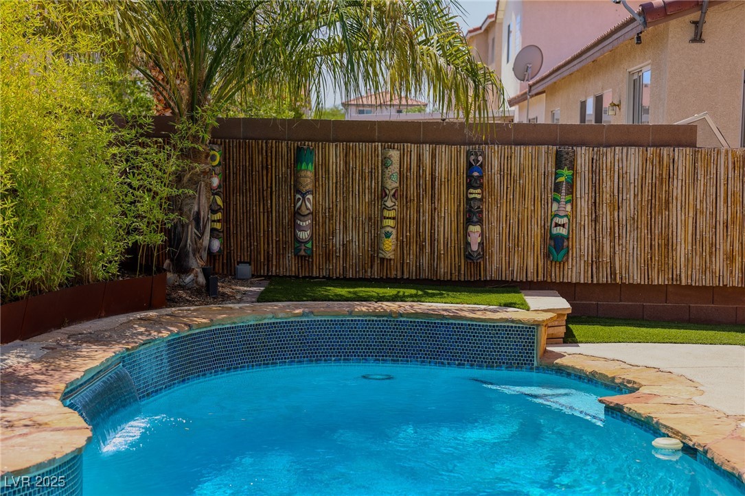 212 Malcolm Street Henderson, NV 89074 - Photo 46 of 47 View of pool featuring a patio area w waterfall- New POOL filters & service 8/2025