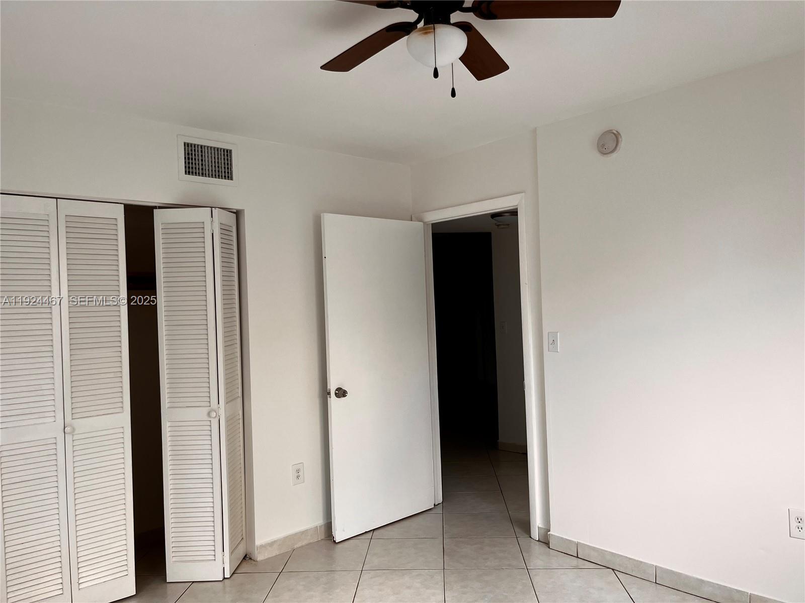 181 Northwest 47th Avenue, Unit 8 Miami, FL 33126 - Photo 14 of 22 a view of a hallway with closet