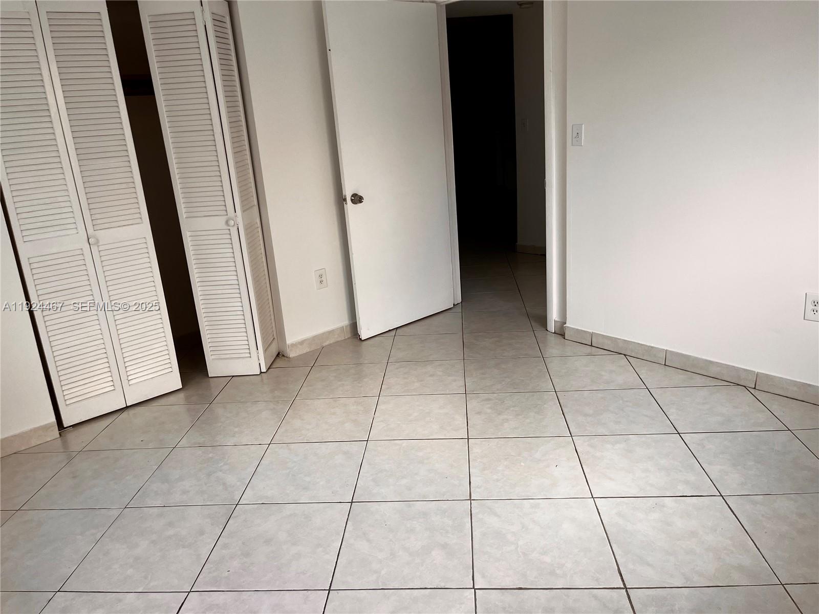 181 Northwest 47th Avenue, Unit 8 Miami, FL 33126 - Photo 15 of 22 a view of a livingroom with an empty space and a window