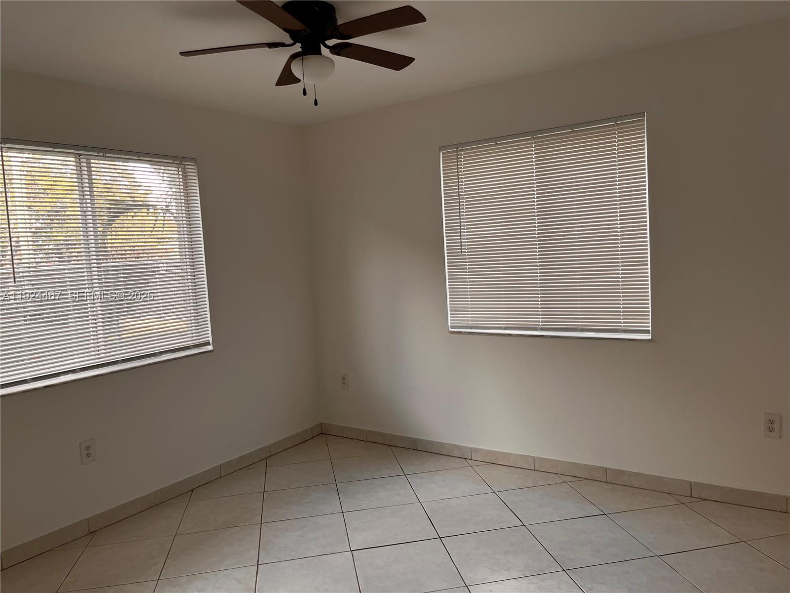 181 Northwest 47th Avenue, Unit 8 Miami, FL 33126 - Photo 16 of 22 a view of an empty room with a window