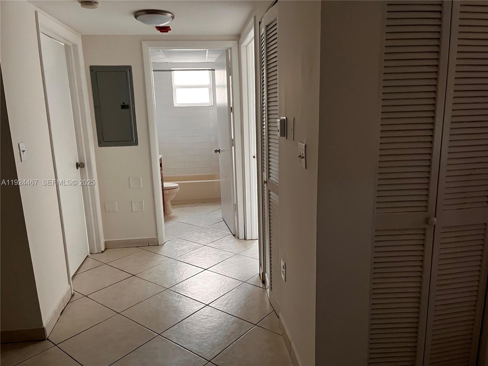 181 Northwest 47th Avenue, Unit 8 Miami, FL 33126 - Photo 6 of 22 a bathroom with a glass door shower and a sink