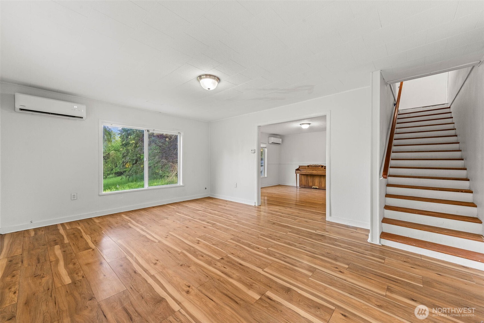 172 South Bank Road Elma, WA 98541 - Photo 21 of 40 a view of a room with wooden floor and a window
