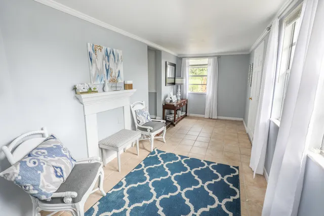 a living room with furniture and a rug