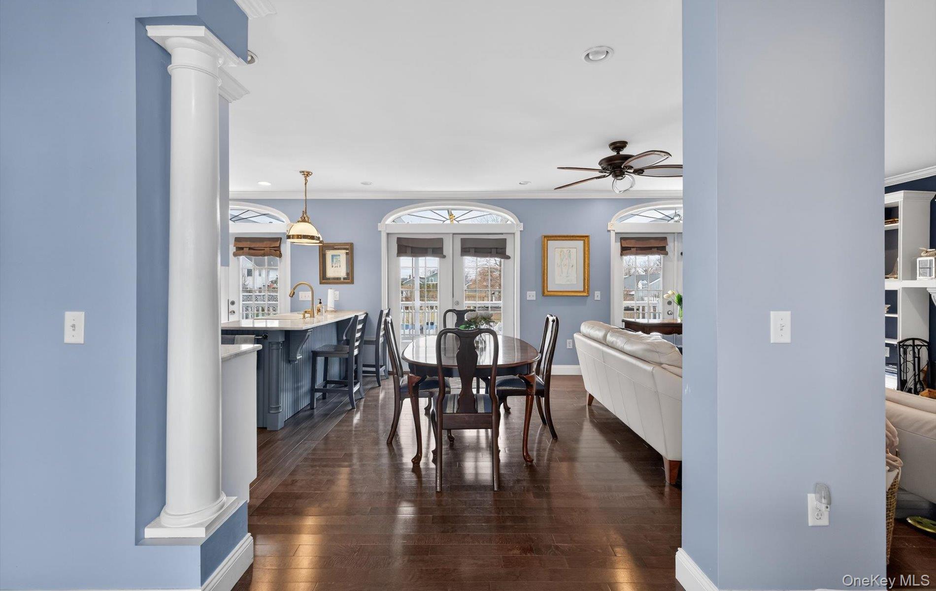 108 Awixa Avenue Bay Shore, NY 11706 - Photo 14 of 47 Dining space featuring decorative columns, dark wood finished floors, ornamental molding, recessed lighting, and a ceiling fan