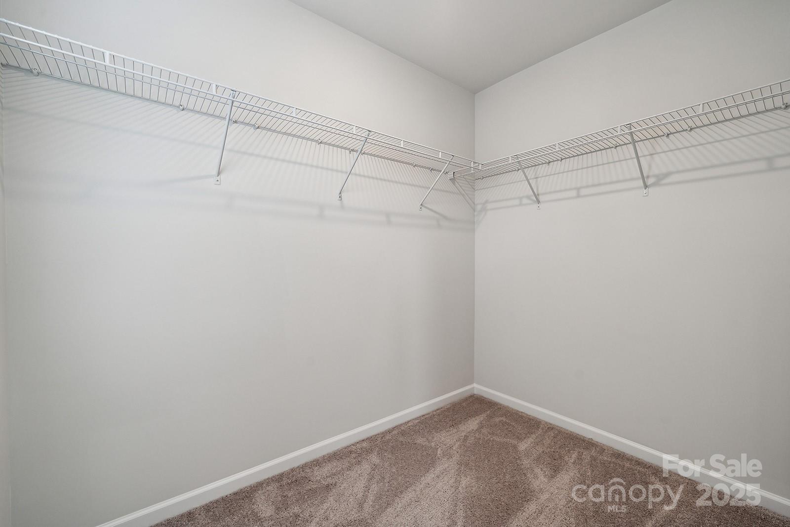 4754 Lakeview Road, Unit 19 Charlotte, NC 28216 - Photo 22 of 27 a view of a room with racks on the wall