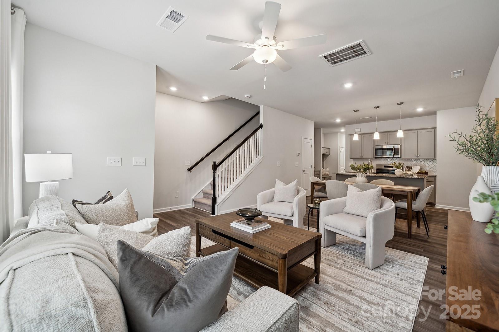 4754 Lakeview Road, Unit 19 Charlotte, NC 28216 - Photo 8 of 27 a bedroom with furniture and a chandelier