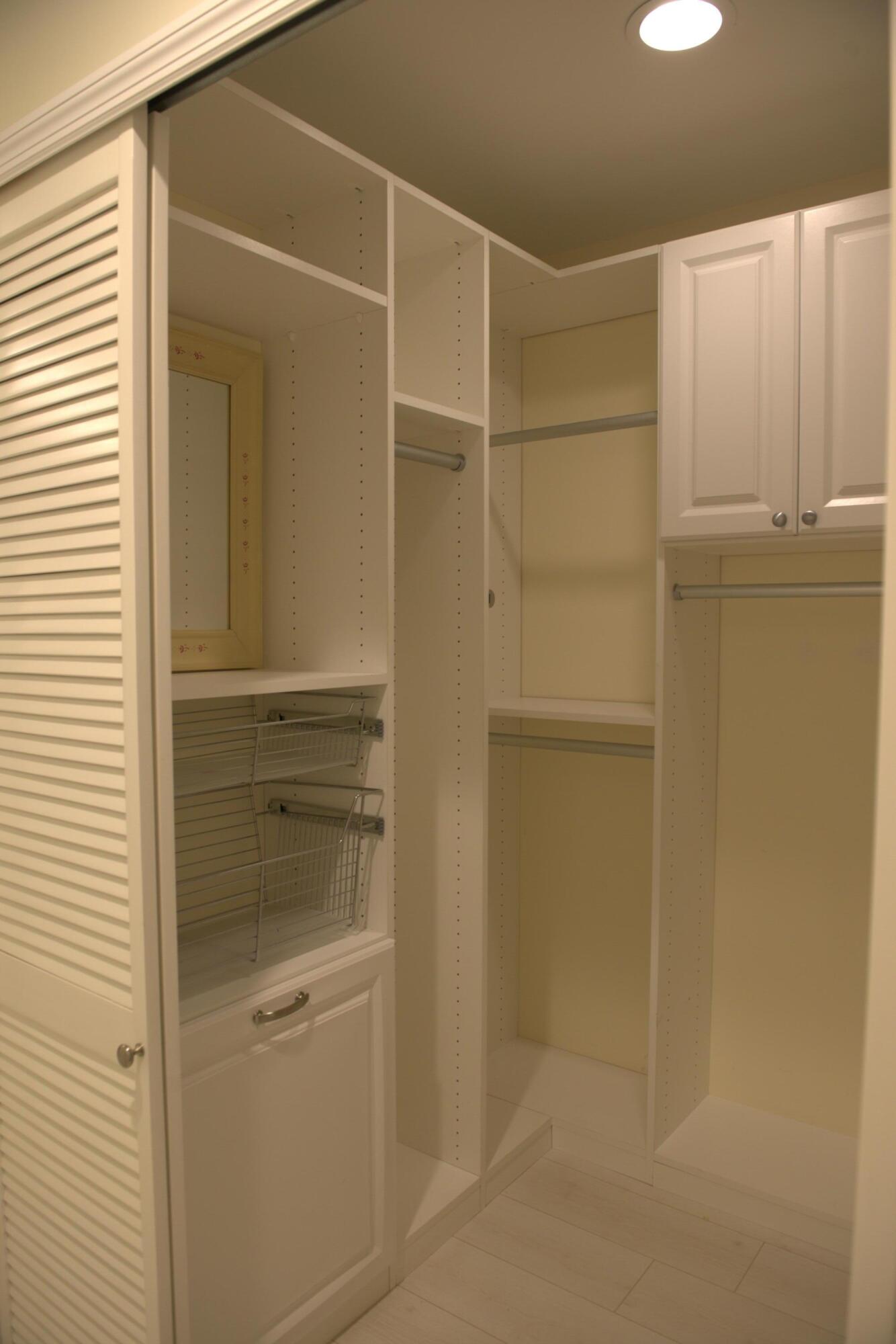 114 Beach Summit Court Jupiter, FL 33477 - Photo 17 of 32 a bathroom with a walk in closet