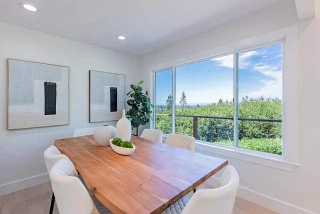 a living room with kitchen island furniture and a view of kitchen