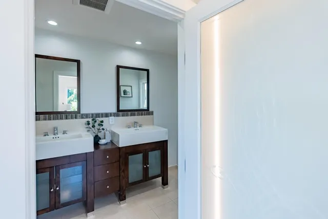 a bedroom with a large bed the desk and chair