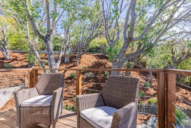 a bed room with a bed and a chair