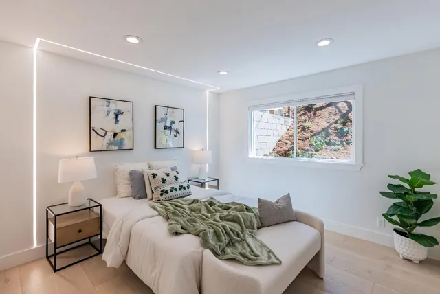 a bathroom with a tub a sink and a shower