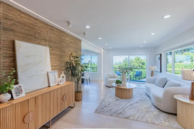 a lobby with furniture and potted plant