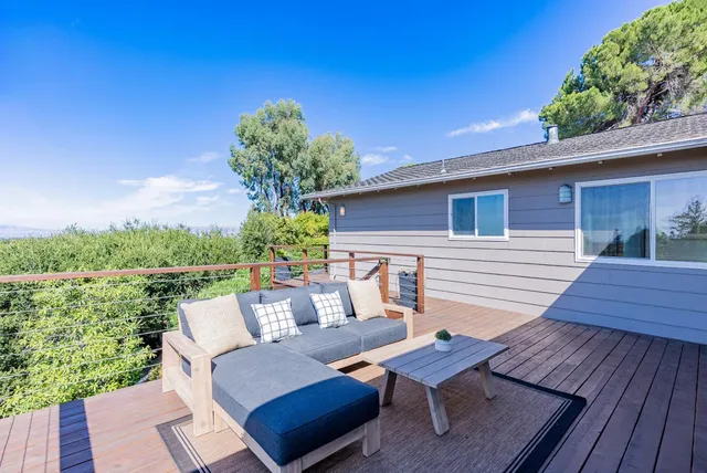 a view of a house with a tree