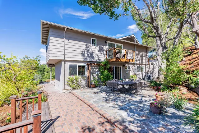 a view of a patio with couches and potted plants