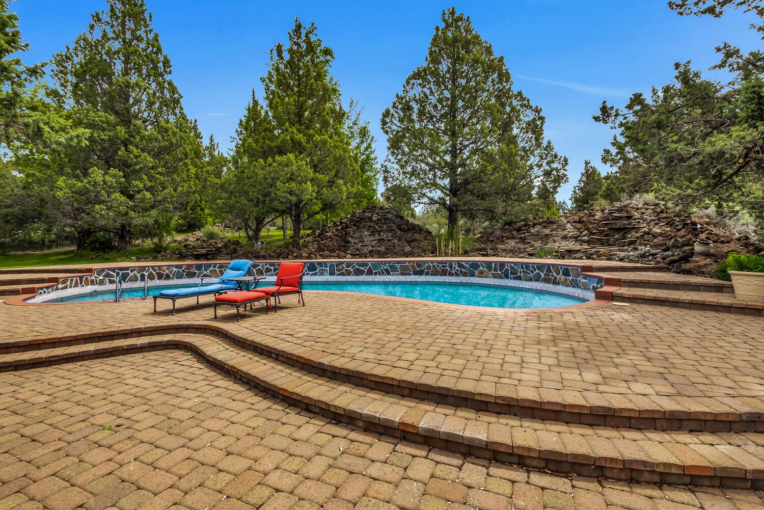 60470 Arnold Market Road Bend, OR 97702 - Photo 31 of 53 Extensive pavers provide room for chaise lounges and other seating.