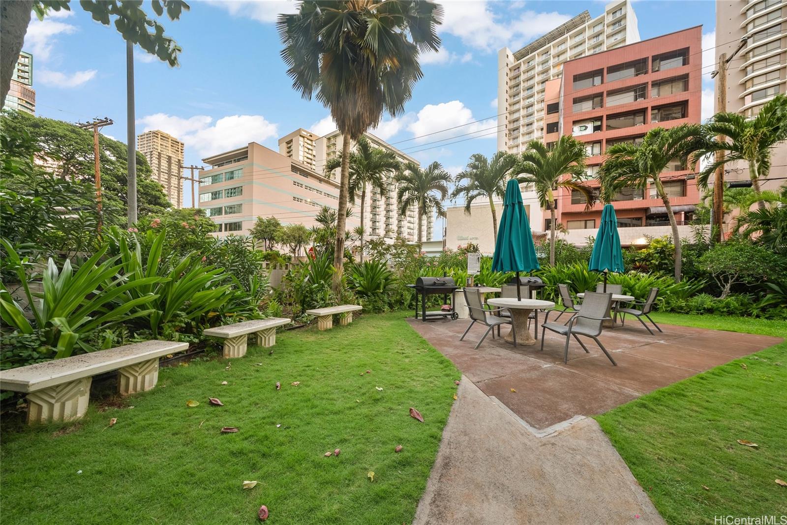 425 Ena Road, Unit B602 Honolulu, HI 96815 - Photo 15 of 16 a view of a house with a yard and sitting area