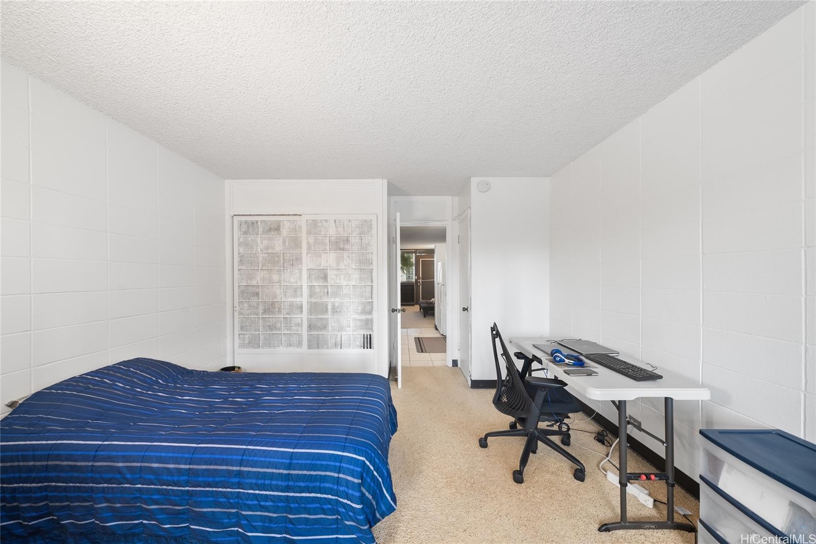 425 Ena Road, Unit B602 Honolulu, HI 96815 - Photo 2 of 16 a view of a workspace with furniture and a window