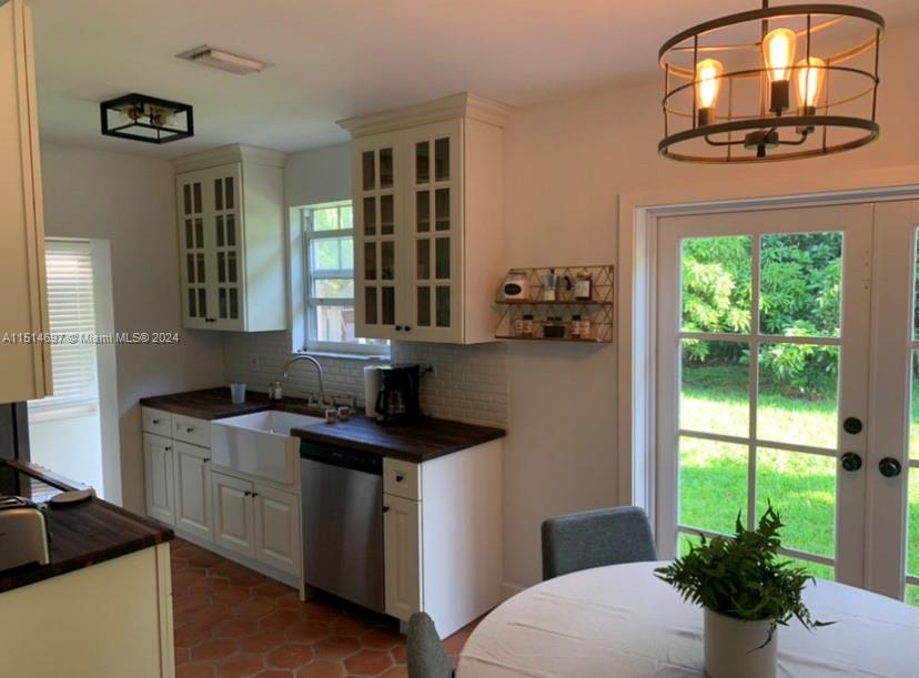 a kitchen with a sink and a stove