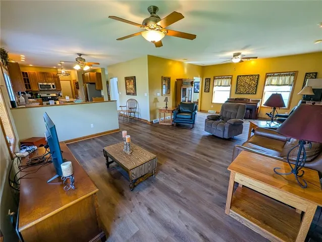 a living room with furniture fireplace and window