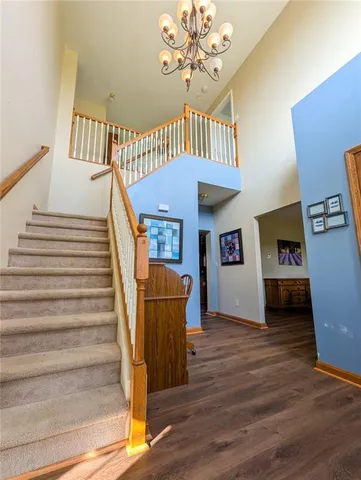 a bathroom with a double vanity sink mirror and toilet