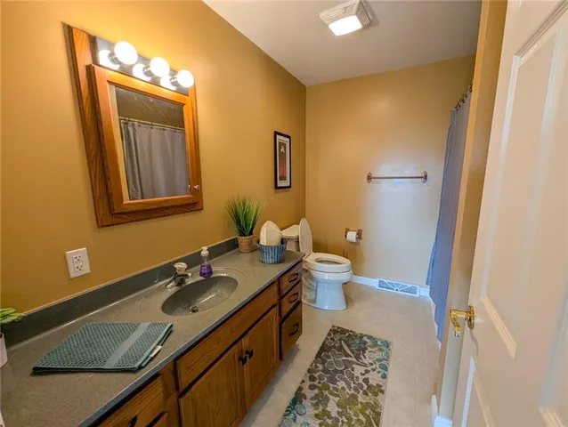 a view of a balcony with wooden floor