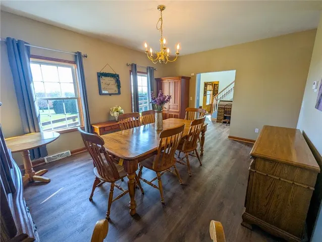 a kitchen with stainless steel appliances granite countertop wooden cabinets a stove top oven a sink and dishwasher