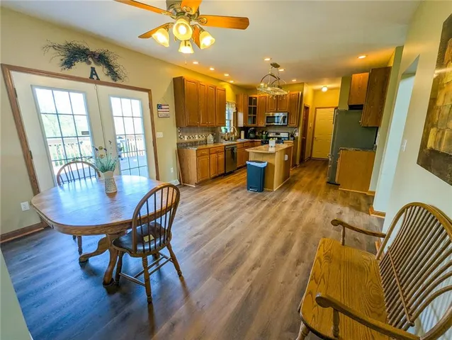 a living room with fireplace furniture and a wooden floor
