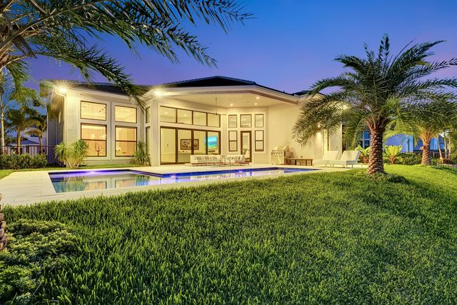 a view of a swimming pool with an outdoor seating