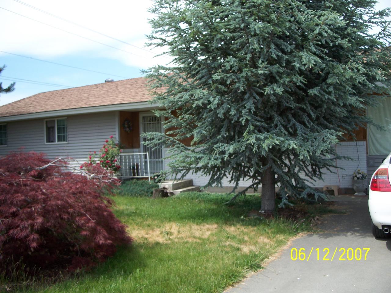 7301 Mieras Road Yakima, WA 98901 - Photo 1 of 12 a front view of a house with garden