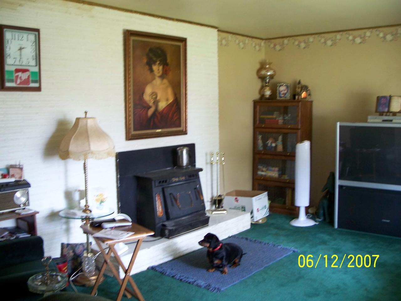7301 Mieras Road Yakima, WA 98901 - Photo 2 of 12 a living room with furniture a rug and a fireplace