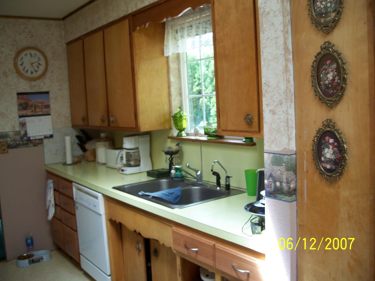 7301 Mieras Road Yakima, WA 98901 - Photo 4 of 12 a kitchen with stainless steel appliances granite countertop a sink a stove and a microwave oven