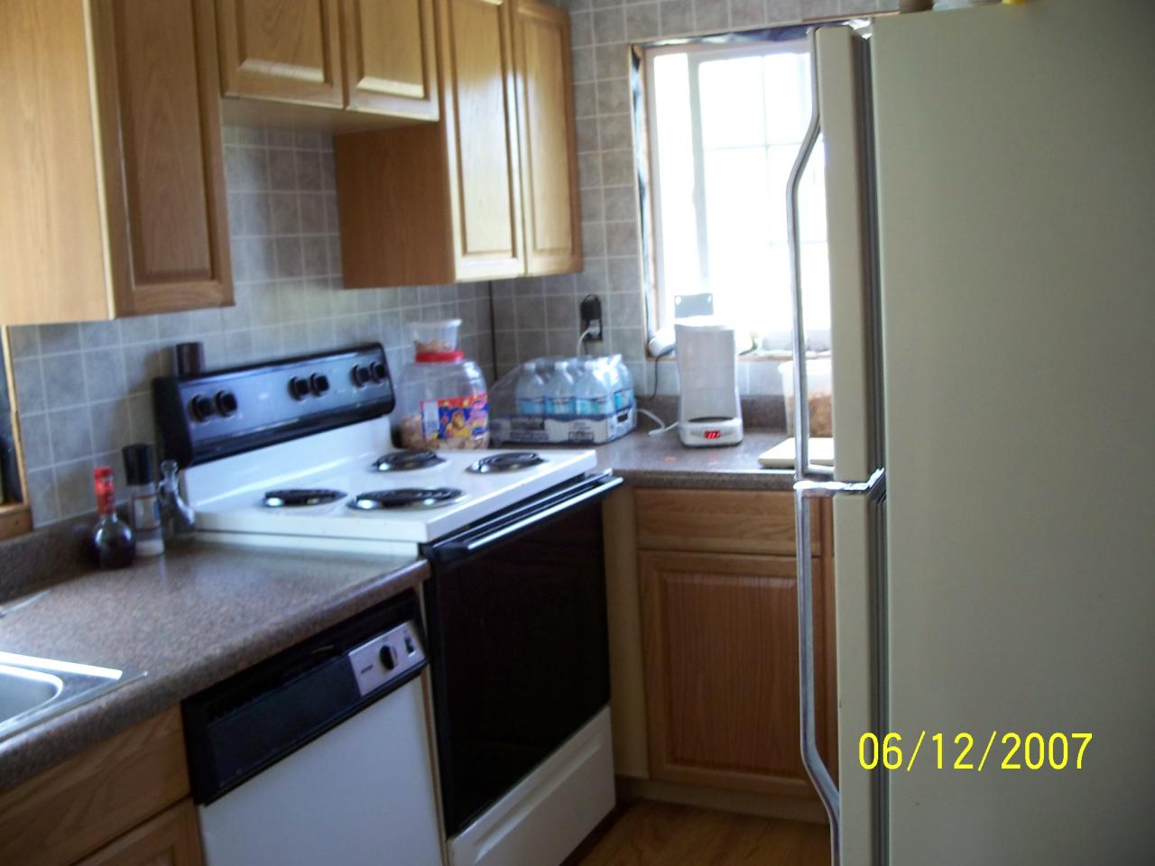 7301 Mieras Road Yakima, WA 98901 - Photo 6 of 12 a kitchen with a sink a stove and a refrigerator
